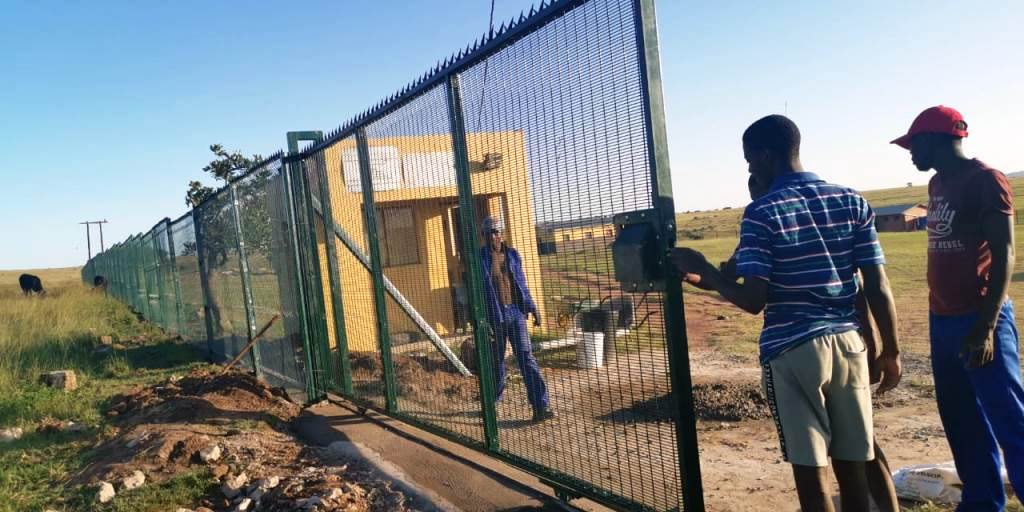 After completing a driveway gate, staff inspecting the work quality.